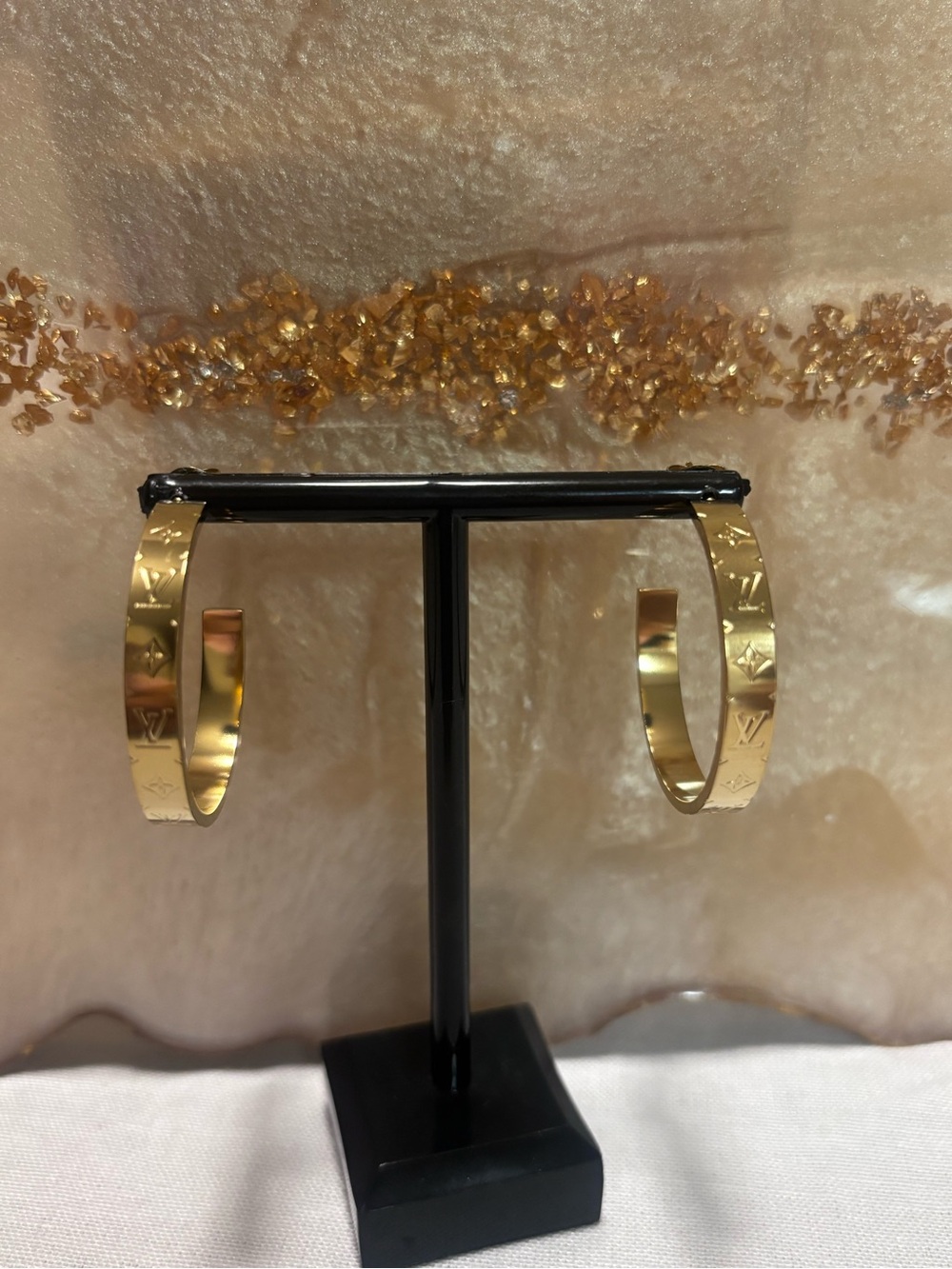 Gold Tone Hoop Earrings with Monogram Detailing